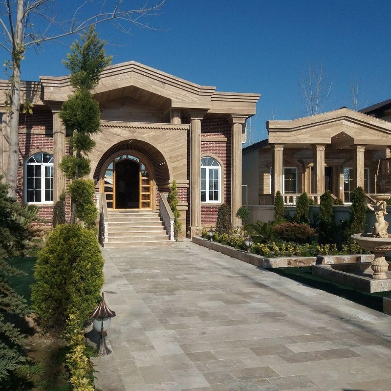 The exterior of a villa with stone and dark bricks