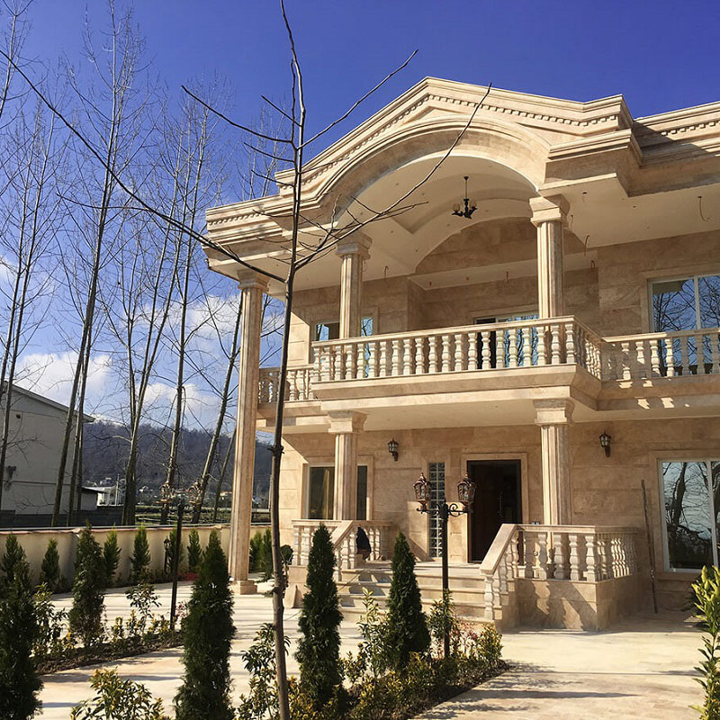 The exterior of a villa with light colored travertine stone (1)